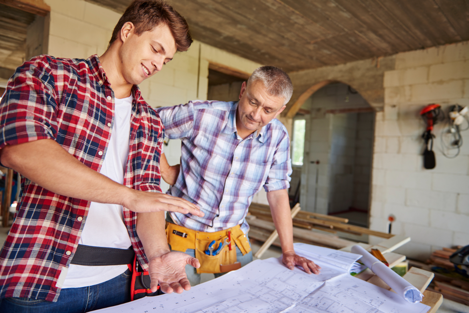 Construction worker analyzing commercial building plans