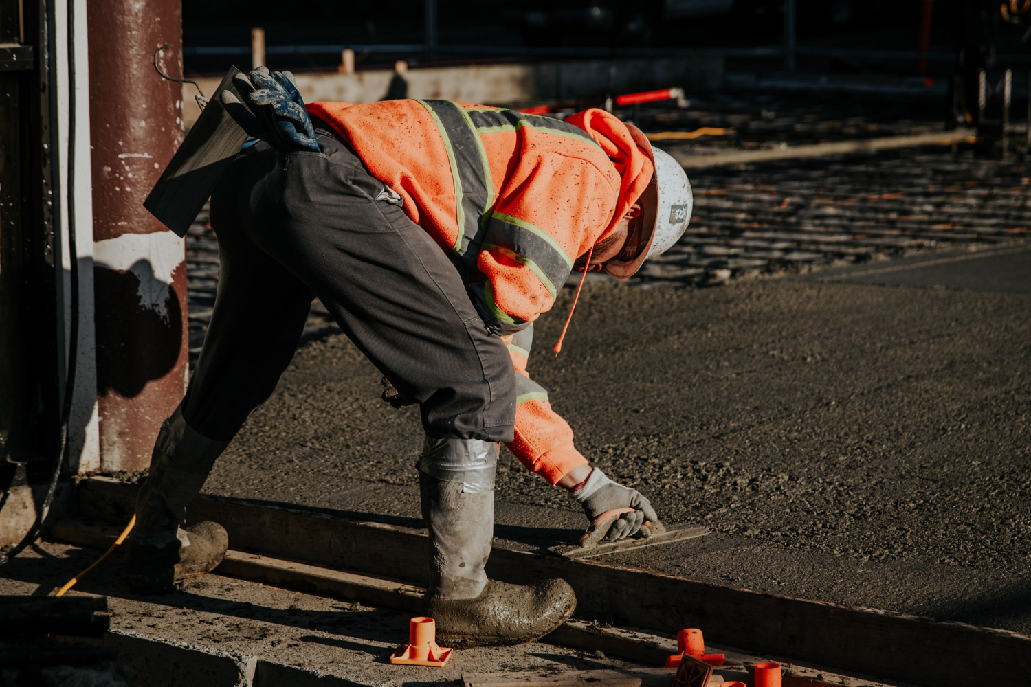 Construction worker reviewing concrete work at a construction site